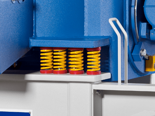 A machine with yellow and red springs on it.
