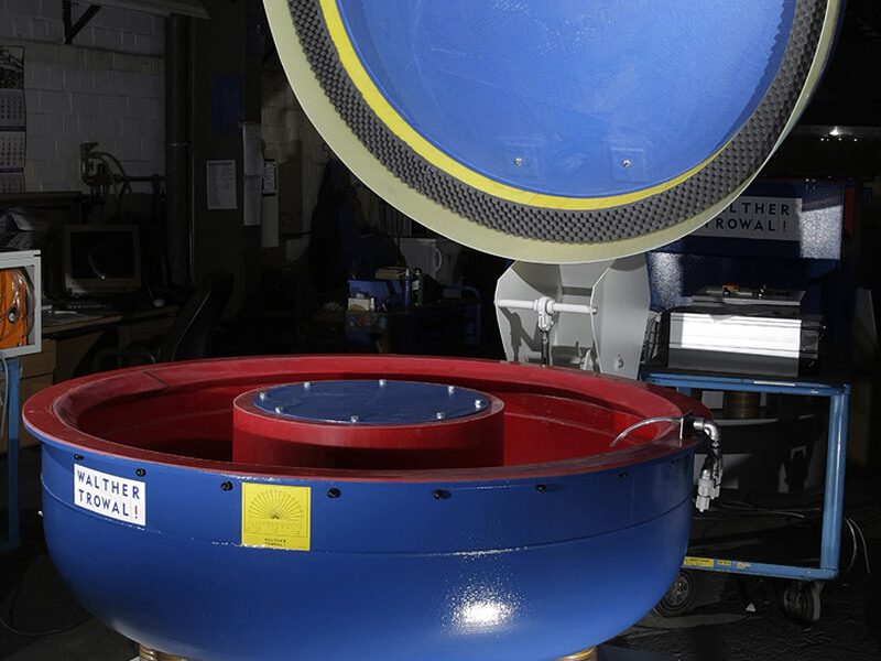 A blue and red machine in a factory